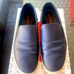 Prada slip on sneakers or espadrilles.